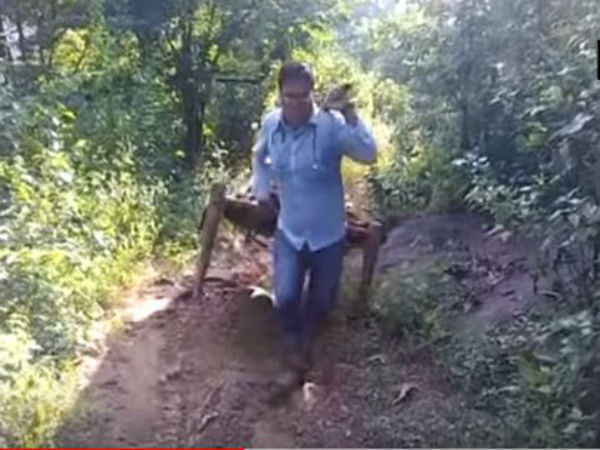 রোগী কাঁধে ৮ কিমি হাঁটলেন চিকিৎসক, ওড়িশার মালকানগিরির ভিডিও হল ভাইরাল রোগী কাঁধে ৮ কিমি হাঁটলেন চিকিৎসক, ওড়িশার মালকানগিরির ভিডিও হল ভাইরাল