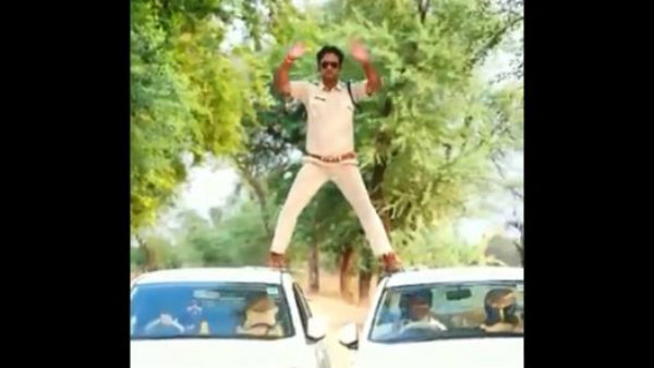A mp sub-inspector showing stunt like singham movie, video goes viral in social media A mp sub-inspector showing stunt like singham movie, video goes viral in social media