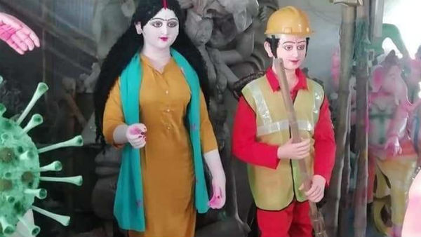 করোনা রূপে অসুর, চিকিৎসকের ভূমিকায় মা দুর্গা! ফের কলকাতার পুজো ভাবনার প্রশংসায় নেট দুনিয়া করোনা রূপে অসুর, চিকিৎসকের ভূমিকায় মা দুর্গা! ফের কলকাতার পুজো ভাবনার প্রশংসায় নেট দুনিয়া